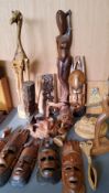 Tribal hardwood masks;  wooden giraffe;  other carvings, robin, owl, stylised figures;  etc