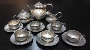 Dolls Accessories - a Victorian pewter dolls house tea service, comprising teapot, six teacups and