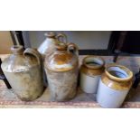 A late 19th century saltglazed stoneware flagon;  others;  two storge jars