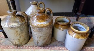 A late 19th century saltglazed stoneware flagon;  others;  two storge jars