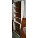 A narrow painted workshop unit, distressed paint, structurally sound