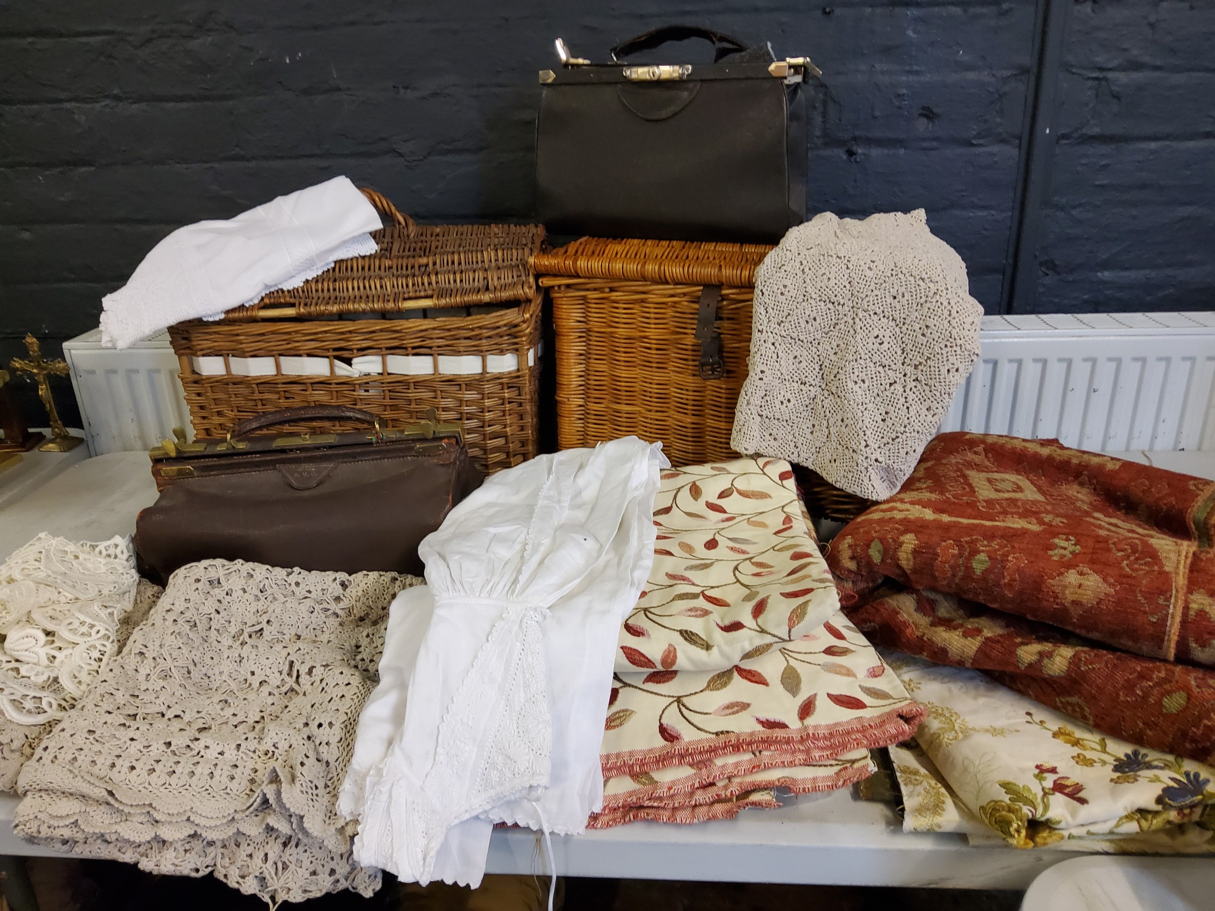 A wicker basket;  another;   a Finnigans leather bag;  leather purses;  Textiles - lace table