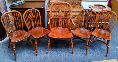 A set of five 20th century ash and elm Windsor chairs, including an elbow chair, pierced vasular