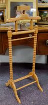 A contemporary bobbin turned valet stand