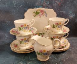 A Royal Standard Country Lane pattern part tea service, comprising four cups, five saucers, six side