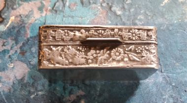 A continental silver coloured metal rectangular snuff box, the cover embossed with figures, 3.5cm