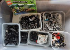 Lego - a Quantity of coloured and branded pieces, split into colours, mostly black and grey.