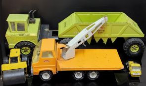 Mighty Tonka lime green Bottom Dump toy. Type number 54690, damage to cab window, 77cm long x 20cm