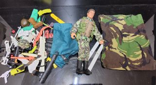 Action Man - an 1993 brown fuzzy hair figure, camouflage uniform, accessories including scuba,