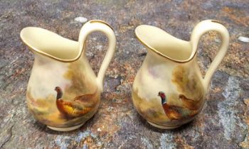 A pair of Royal Worcester miniature ewers, painted by Jas. Stinton, signed, with pheasants, 5.5cm