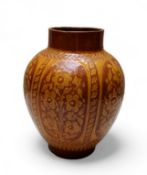 An unusual 19th century West Country slipware vase, decorated in relief with arched floral panels,