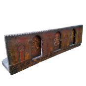 A large carved and polychrome painted Moroccan / Marrakesh doorway panel, 33cm high,111cm wide,