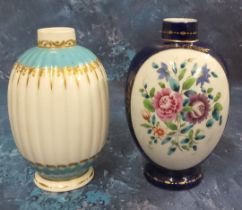 A Worcester tea canister, painted with an oval cartouches with Chinese style flowers, cobalt blue