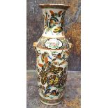 A 19th century Chinese vase, decorated in polychrome with butterflies and insects, gilt mask