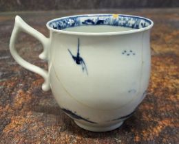 A Worcester Walk in the Garden pattern bell shaped coffee cup,  tau handle, decorated in