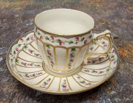 A Bristol coffee cup and saucer, painted with rose chains in gilt panels, X in blue; 5. in gilt, c.