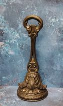 A Victorian cast iron door stop, posted handle, the demi-lune base cast with acanthus, signed