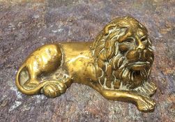 English School, Regency, a bronze, lion reclining, 11.5cm long