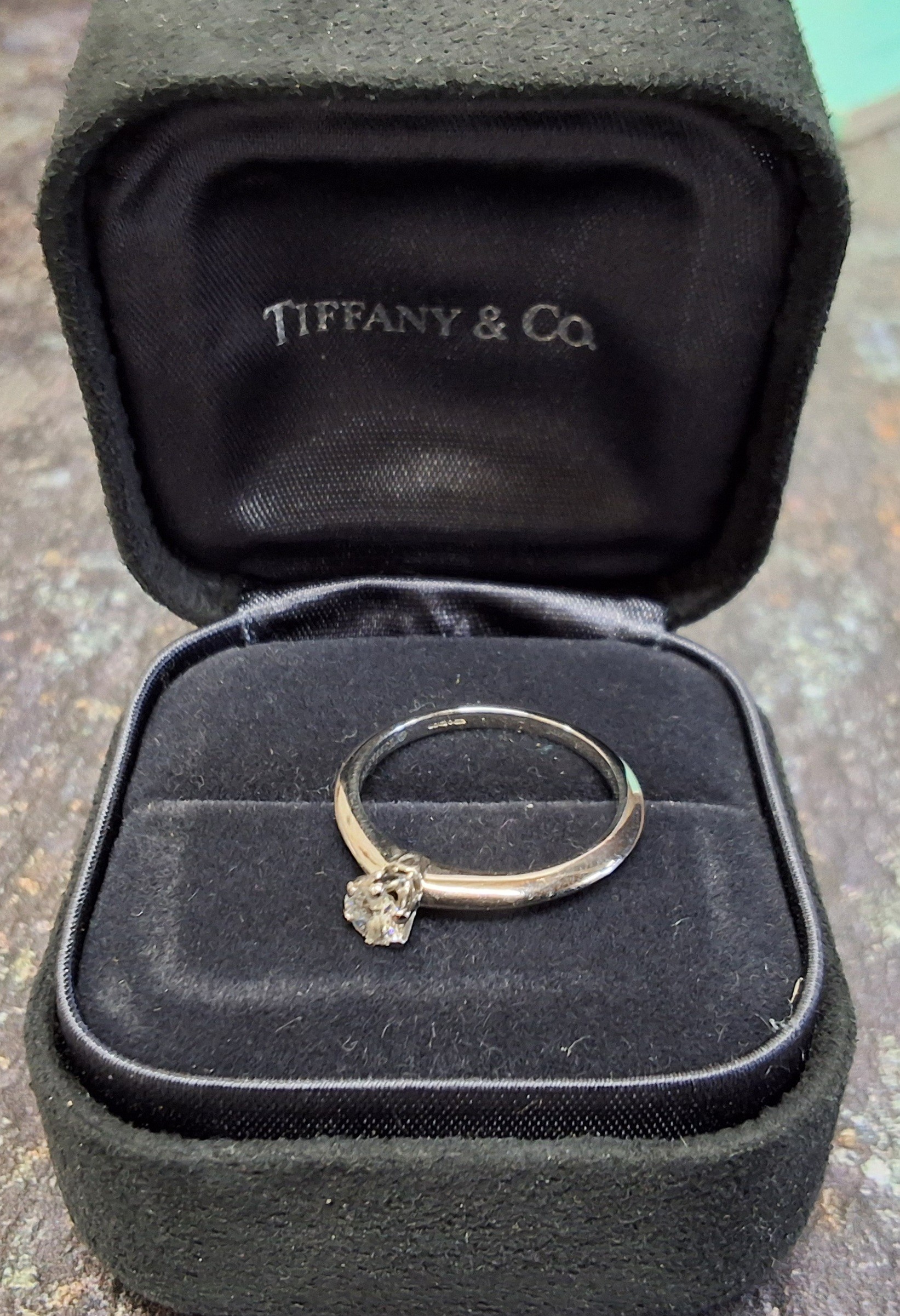 A Tiffany & Co platinum and diamond solitaire, claw set brilliant cut round diamond, 0.25ct, 4. - Image 2 of 2