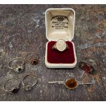A marcasite and red stone dress ring; others; an armorial ring; etc