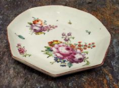 A Chelsea octagonal saucer, painted with flower sprays and single scattered sprigs, red line border,
