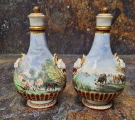 A pair of Minton flasks and covers,  each side painted with a  Herdsman and cattle,  fluted bases,