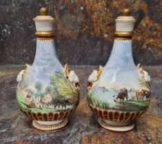 A pair of Minton flasks and covers,  each side painted with a  Herdsman and cattle,  fluted bases,