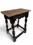 An early 17th century English oak joint stool, 61cm high, 53.5cm wide, 28.5cm depth