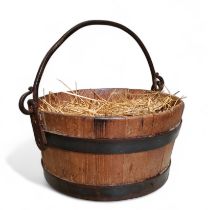 A coopered pail, iron bands, swing handle, 22.5cm diam, 11.5cm high