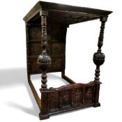 A fine and rare Elizabeth I oak tester bed,  the oversailing thirteen fielded panelled tester canopy