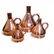 A graduated set of four Victorian copper  haystack measures, loop handles, 2 gallon, 1 gallon, 1/