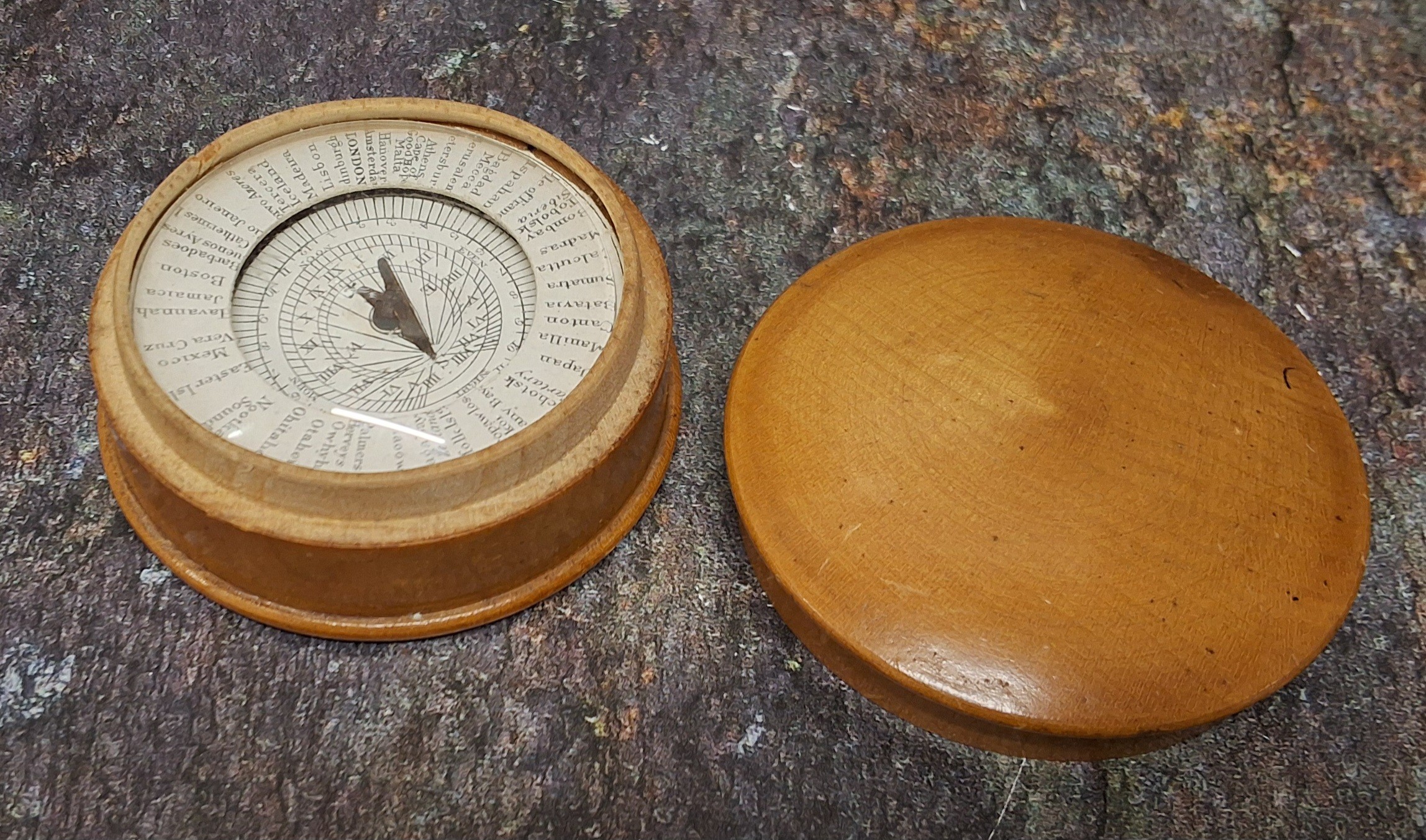 A 19th century boxwood Pantochronometer, central sun dial pivoting with angled gnomon within a broad