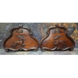 A pair of 19th century mahogany cartouche shaped panels, with leaping deer, floral roundel, 26cm