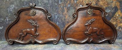 A pair of 19th century mahogany cartouche shaped panels, with leaping deer, floral roundel, 26cm