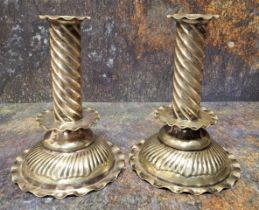 A pair of late 19th century plated candlesticks, spirally fluted columns, low drip plates, domed