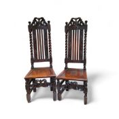 A fine pair of Charles II oak high back hall chairs c.1680