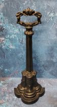 A Victorian cast iron door stop, posted handle, the demi-lune base cast with acanthus, signed