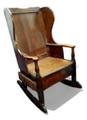 An 18th century ash and elm rocking lambing chair with single drawer to frieze c.1760