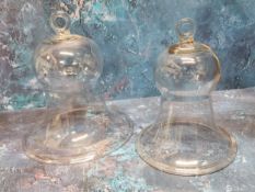 A 19th century glass smoke bell, 23cm high, c.1860; another, 20.5cm (2)