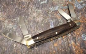 A Stan Shaw four blade pocket knife, polished horn scales, vacant cartouche, workback to springs and