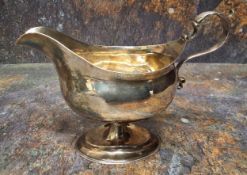 A George III silver pedestal sauceboat, acanthus scroll handle, oval spreading base, 13cm high,