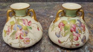 A pair of Royal Worcester lobed ovoid two  handled vases,  painted with flowers in prismatic