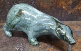 A Rye Pottery badger, in tones of blue, signed, David Sharp, Rye Pottery R, approx. 35cms long