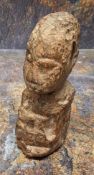 An unusual fossilized wood carving, of a head, 12cm high