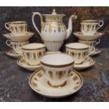 A set of seven Copeland and Garrett coffee cups and saucers, decorated in gilt with stylised leaves,