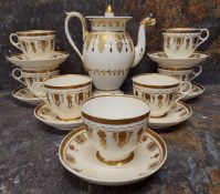A set of seven Copeland and Garrett coffee cups and saucers, decorated in gilt with stylised leaves,
