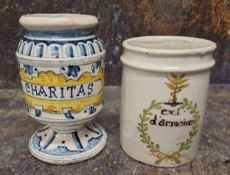 An Italian faience pedestal drug jar, Charitas, 14.5cm high, probably 19th century; another,