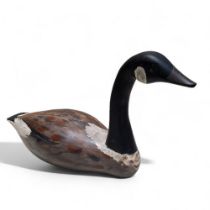 Folk Art - a painted softwood Canadian Goose decoy, 31cm high, 56cm wide