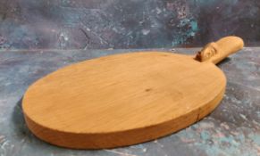Robert Thompson, Mouseman of Kilburn - an oak paddle shaped cheese board, 40cm long, carved mouse