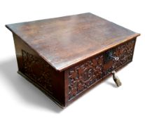 A Charles I oak writing box, carved front and side panels, dated 1640 monogrammed 'MS', with key,